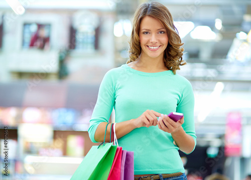 Photo: Texting shopper Texting shopper