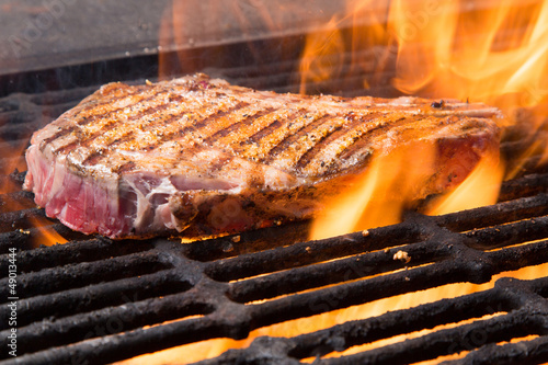 Photo: Raw Steak on a Grill Raw Steak on a Grill