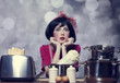 Surprised girl with at kitchen.