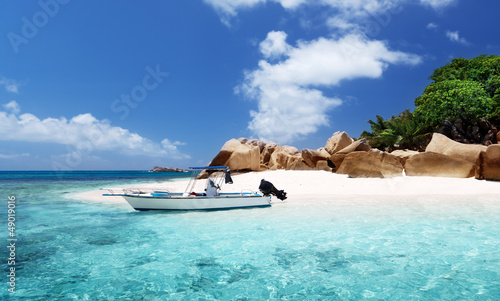 Photo: speed boat on the beach of Coco Island, Seychelles speed boat on the beach of Coco Island, Seychelles