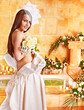 Woman wearing wedding dress.