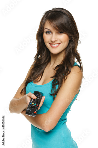 Photo: Happy woman holding TV remote control Happy woman holding TV remote control