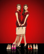two teenage girls in red dresses with bag