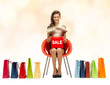 girl in red dress with shoes, bag and sale sign