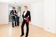 Photo: Young couple looking for real estate with female realtor. Young couple looking for real estate with female realtor.