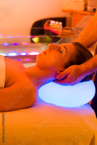 Photo: Woman enjoying therapy in spa with color therapy Woman enjoying therapy in spa with color therapy