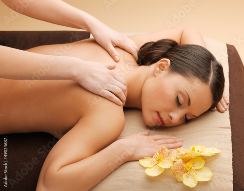 Photo: beautiful woman in massage salon beautiful woman in massage salon