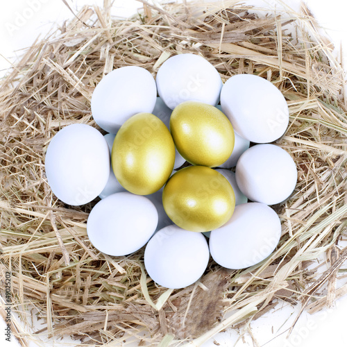 Photo: Three golden eggs in nest Three golden eggs in nest