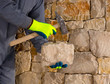 Photo: stonecutter mason with hammer and stone working masonry stonecutter mason with hammer and stone working masonry