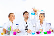 Photo: Team of scientists working in laboratory Team of scientists working in laboratory