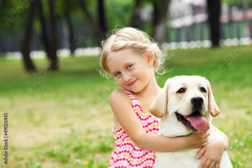 Photo: little girl with her dog little girl with her dog