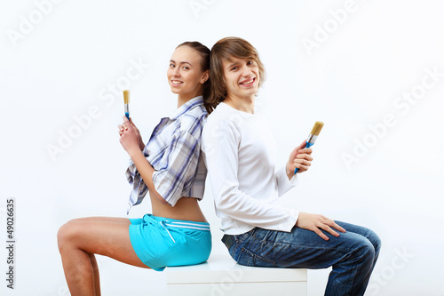 Photo: Couple with paint brushes Couple with paint brushes