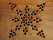 piece of wood with inlays and perforated