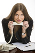 Smiling business woman with phone receiver
