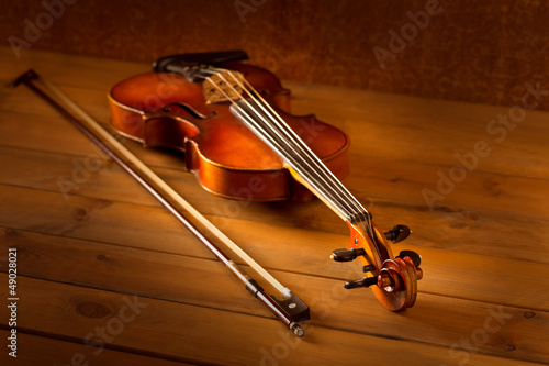 Photo: Classic music violin vintage in wooden background Classic music violin vintage in wooden background
