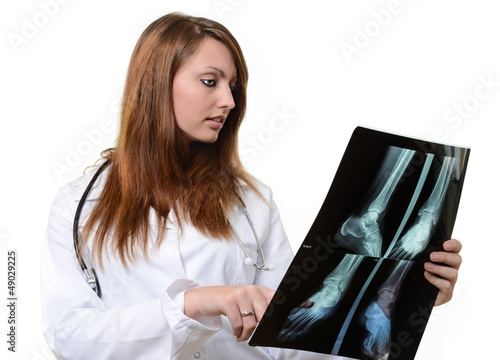 Photo: female doctor looking at X-ray image female doctor looking at X-ray image