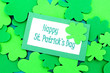 Happy St Patricks Day tag over shamrock background