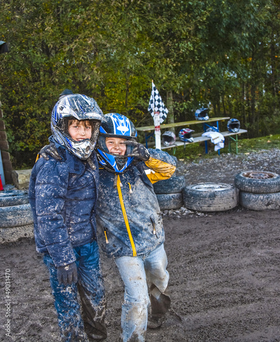 Photo: child loves to race with a quad at the muddy quad track child loves to race with a quad at the muddy quad track