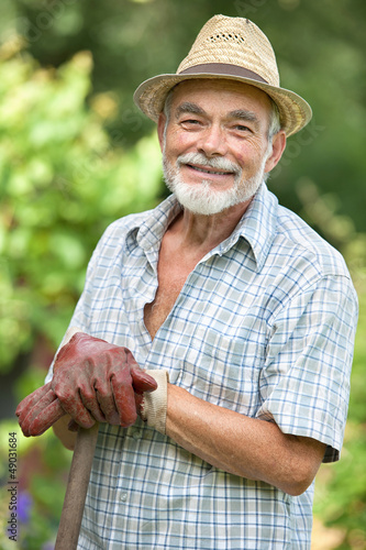 Photo: Senior gardener with a spade Senior gardener with a spade