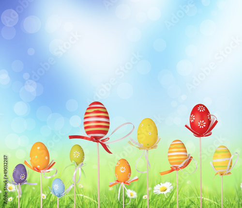 Photo: Happy Easter eggs in meadow Happy Easter eggs in meadow