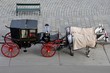 Tourists black and red horse carriage - Vienna Austria