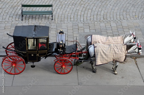 Photo: Tourists black and red horse carriage - Vienna Austria Tourists black and red horse carriage - Vienna Austria