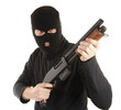 Masked man aims with rifle