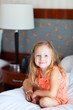 Photo: Little girl at hotel room Little girl at hotel room