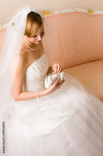 Photo: Bride and purse Bride and purse