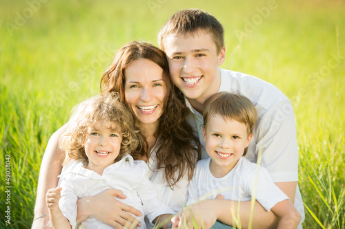 Photo: Happy family in spring field Happy family in spring field