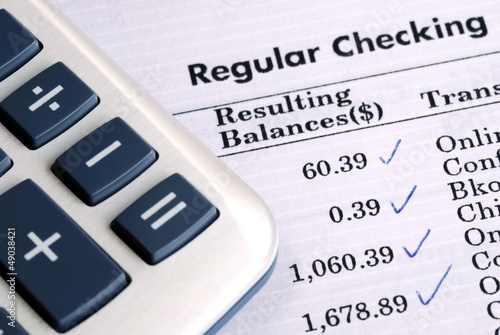 Photo: Check the bank statement and balance the account Check the bank statement and balance the account