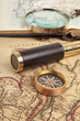 Photo: Brass telescope on map Brass telescope on map