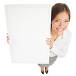 Woman showing a white board sign poster