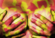 Hands covering breasts