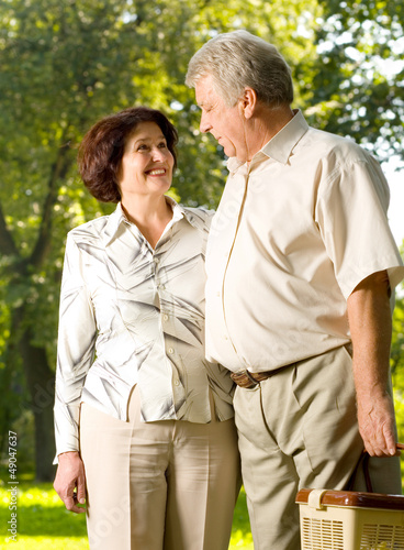 Photo: Happy senior couple walking outdoor Happy senior couple walking outdoor