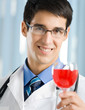 Smiling young doctor with redwine