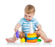 baby boy playing with colorful toy isolated on white