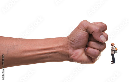 Photo: young man standing infont of punching hand young man standing infont of punching hand