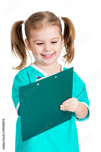 Photo: Adorable kid girl uniformed as doctor over white background Adorable kid girl uniformed as doctor over white background