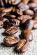 Photo: Coffee beans in a linen napkin close up Coffee beans in a linen napkin close up