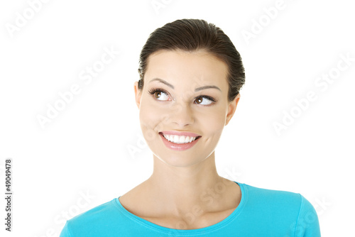 Photo: Beautiful thoughtful woman looking up Beautiful thoughtful woman looking up