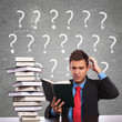 business man scratching his head while reading