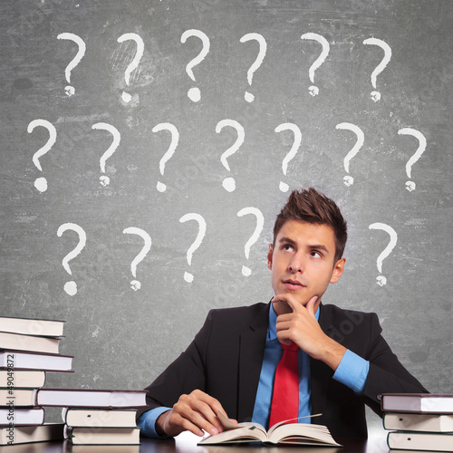 Photo: confused young student reading confused young student reading