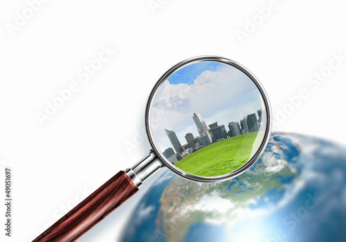 Photo: conceptual mini planet with a city on it conceptual mini planet with a city on it