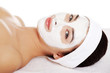 Beautiful woman with clay facial mask