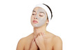 Beautiful woman with clay facial mask