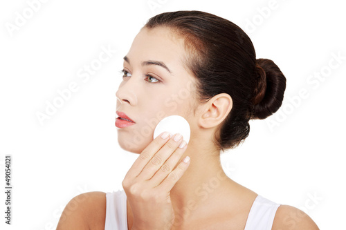 Photo: Beautiful woman with cotton pad Beautiful woman with cotton pad