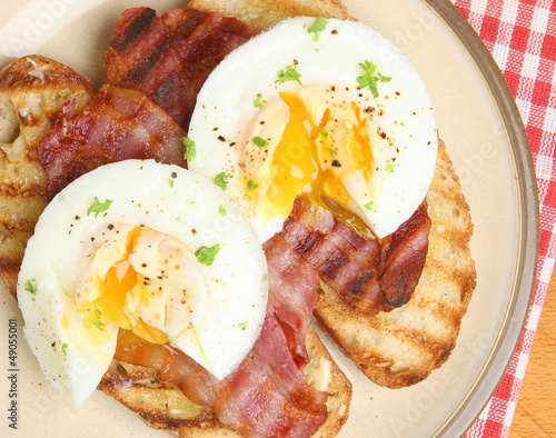 Photo: Poached Eggs and Bacon on Toast Poached Eggs and Bacon on Toast