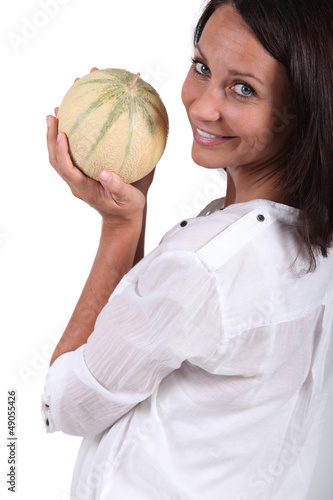 Photo: Woman holding melon Woman holding melon