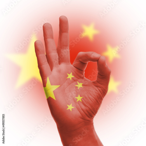 Photo: hand OK sign with Chinese flag hand OK sign with Chinese flag